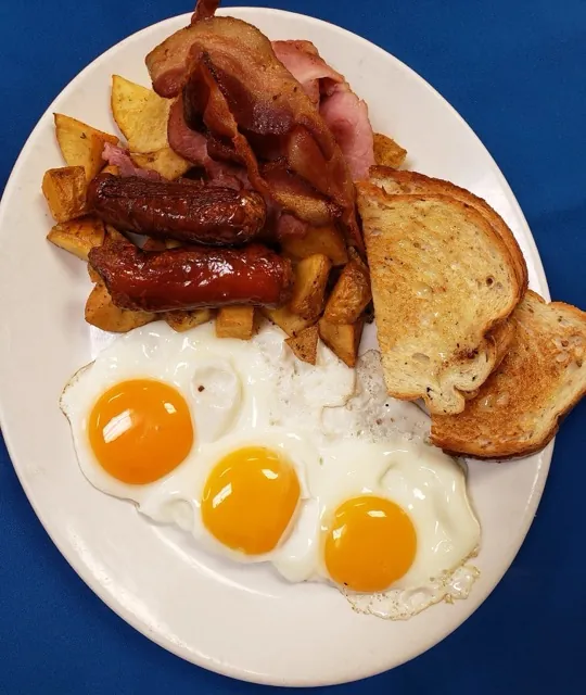 Harvest Breakfast with three eggs, bacon, ham and sausage at Cheryl's Country Kitchen in Airdrie, AB
